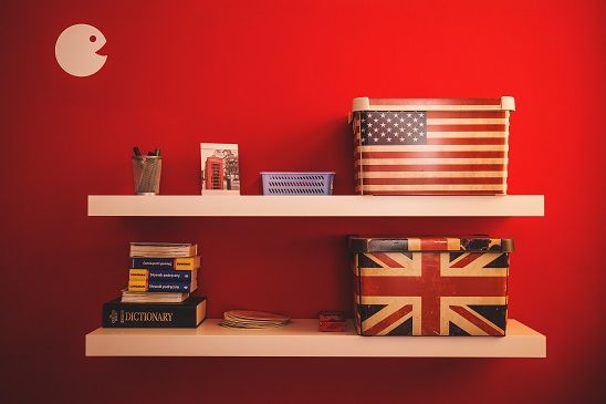 red wall and shelf with dictionary
