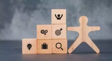 wooden blocks with employee figure