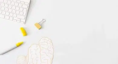 keyboard on the desk with a paper picture of brain
