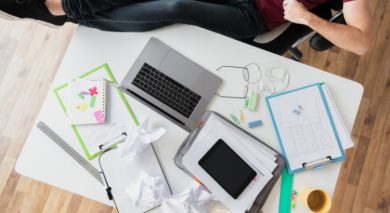 top view shot of guy sitting next to a desk