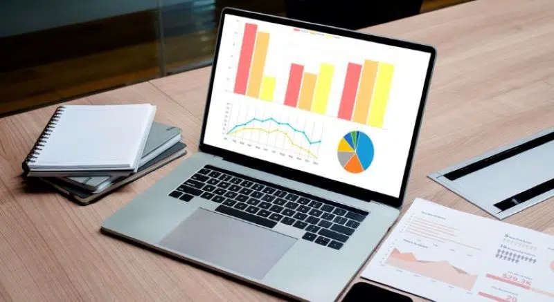 laptop on the desk with statictics